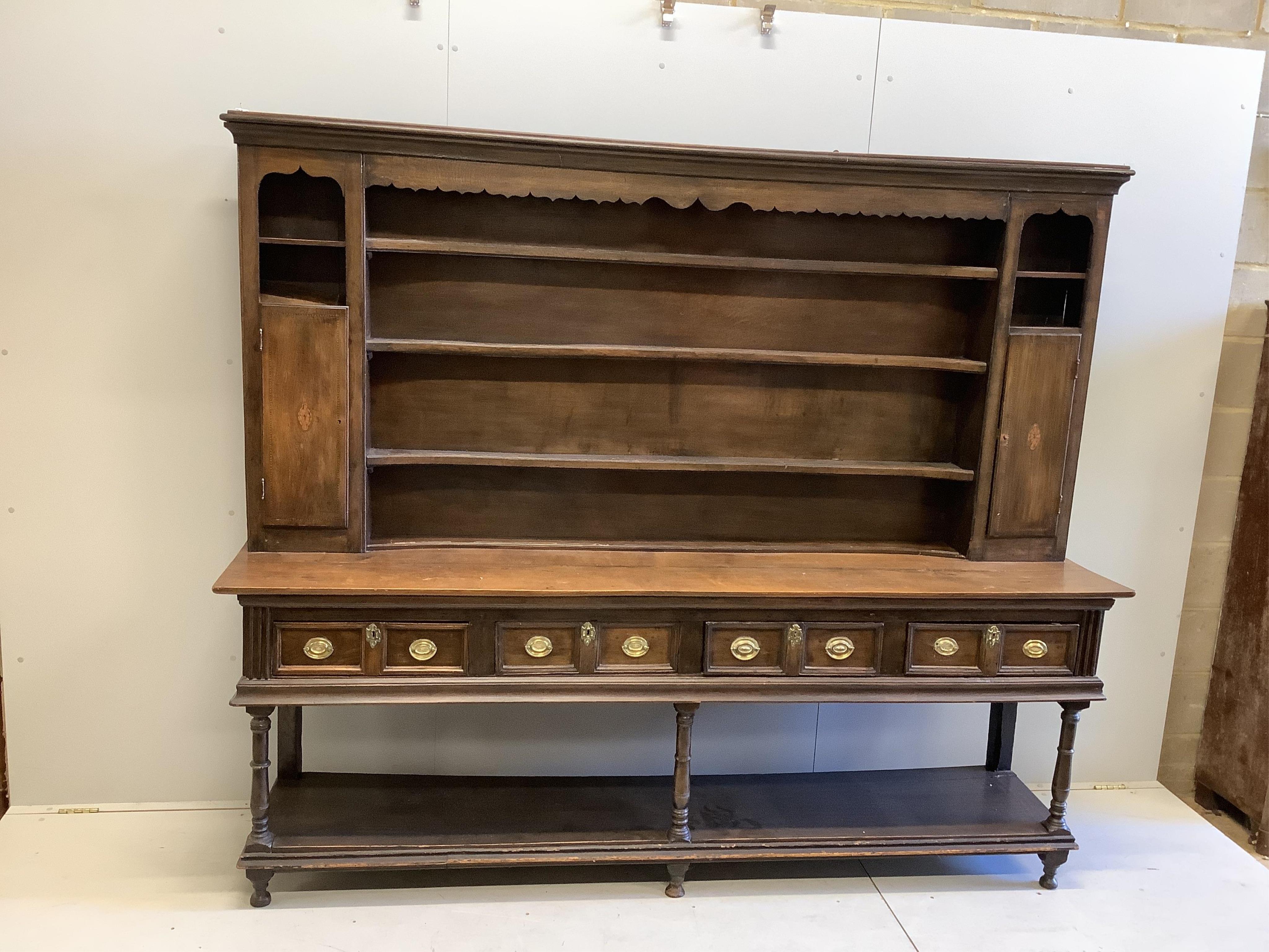 A George III oak pot board dresser with associated boarded rack, width 234cm, depth 49cm, height 197. Condition - fair